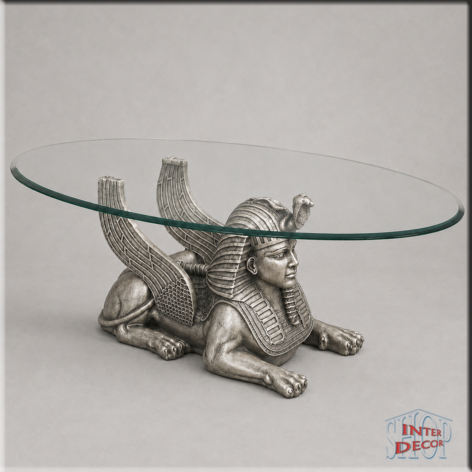 Ägyptischer-Sphinx-Couchtisch-mit-großer-Glasplatte-Antik-Silber